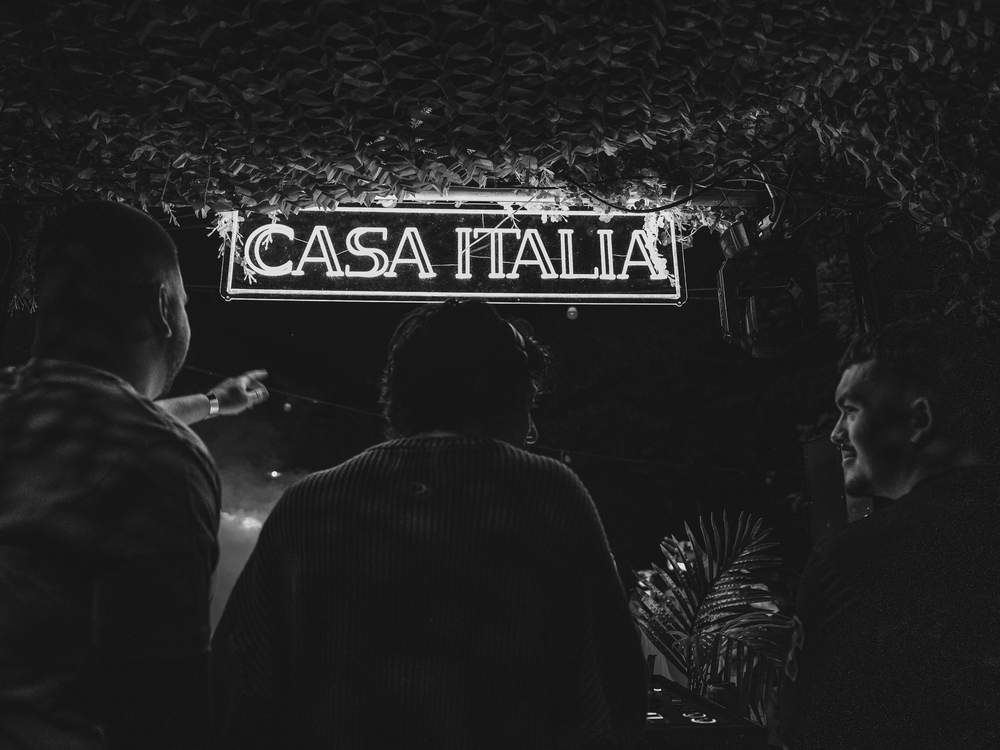 Under the Casa Italia sign
